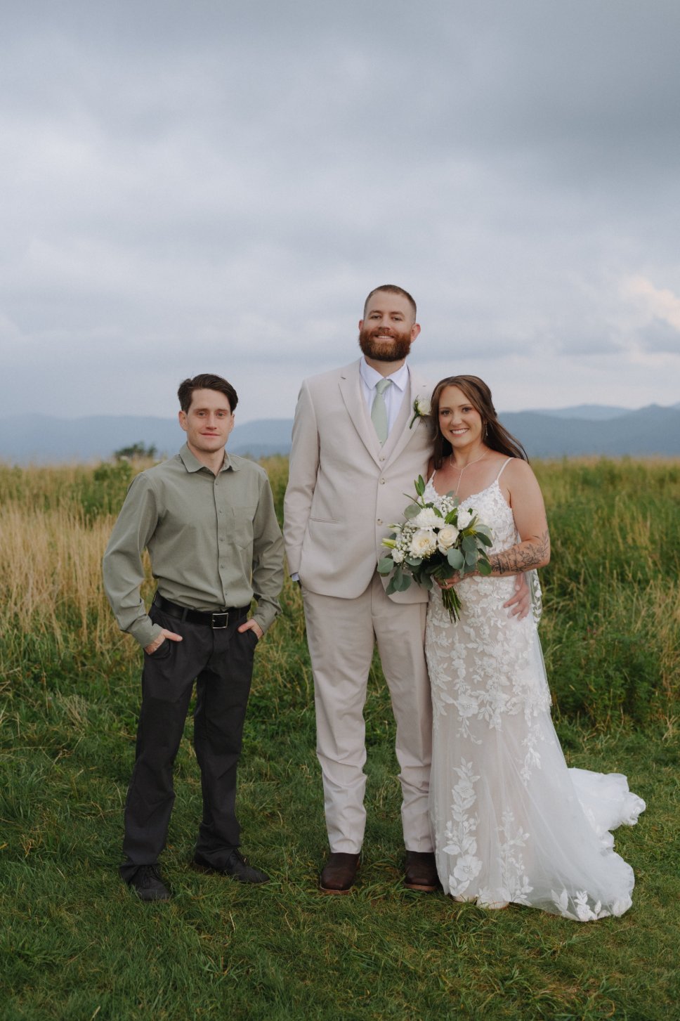 Ashley and Kenneth with their officiant Nathan Gifford in the Max Patch meadow