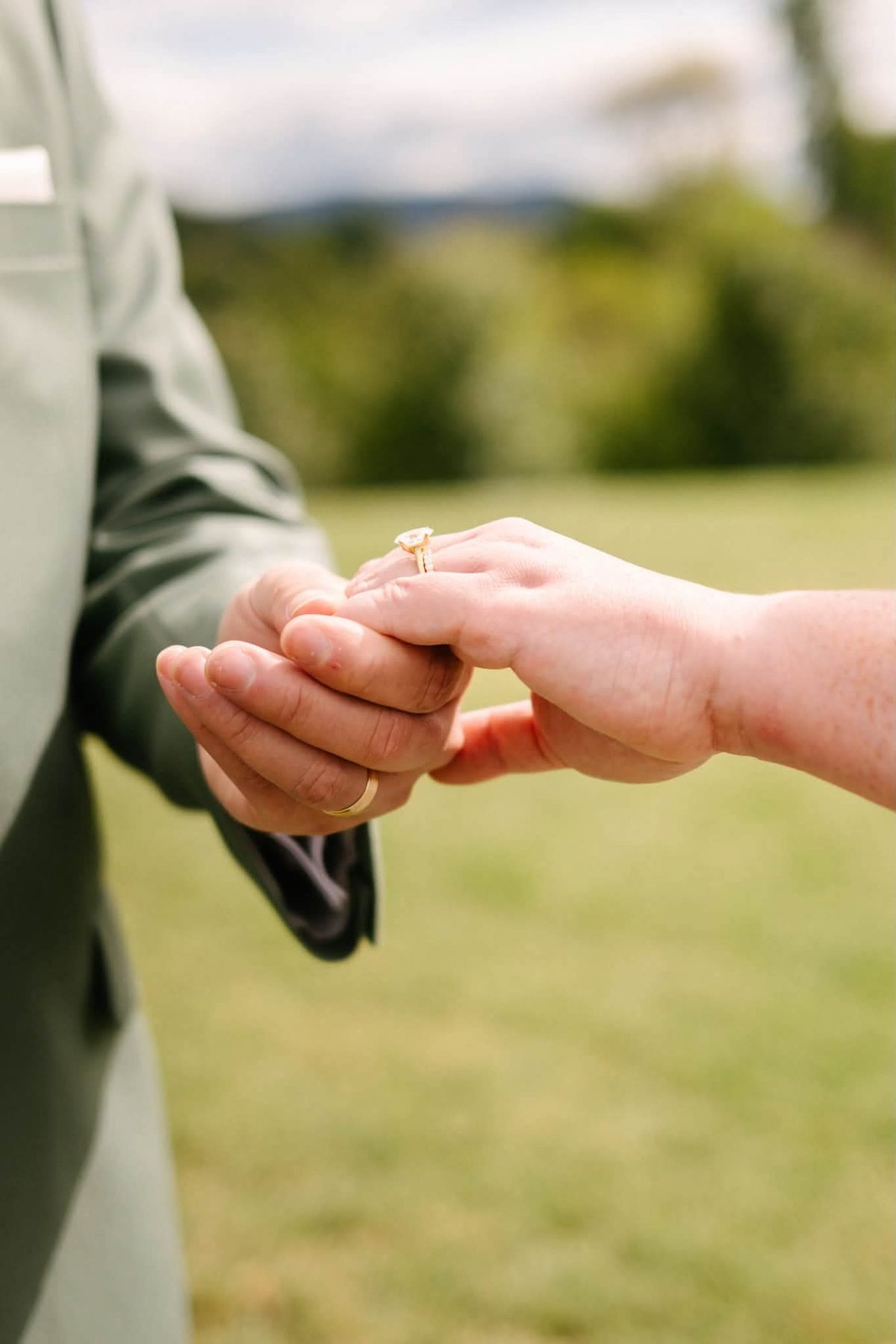 Close up of Christine and Graham's hands and rings