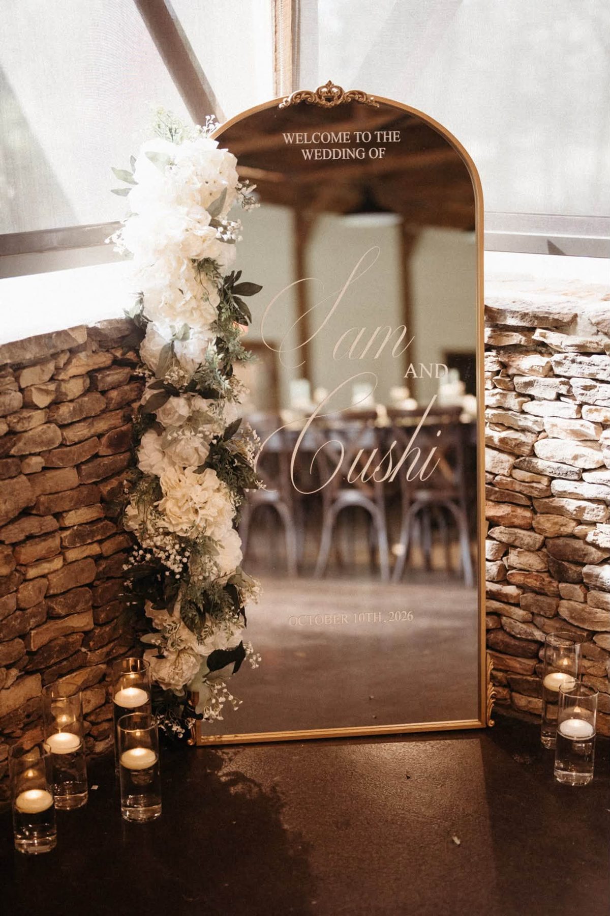Welcome mirror with Cushi and Sam's names and wedding date