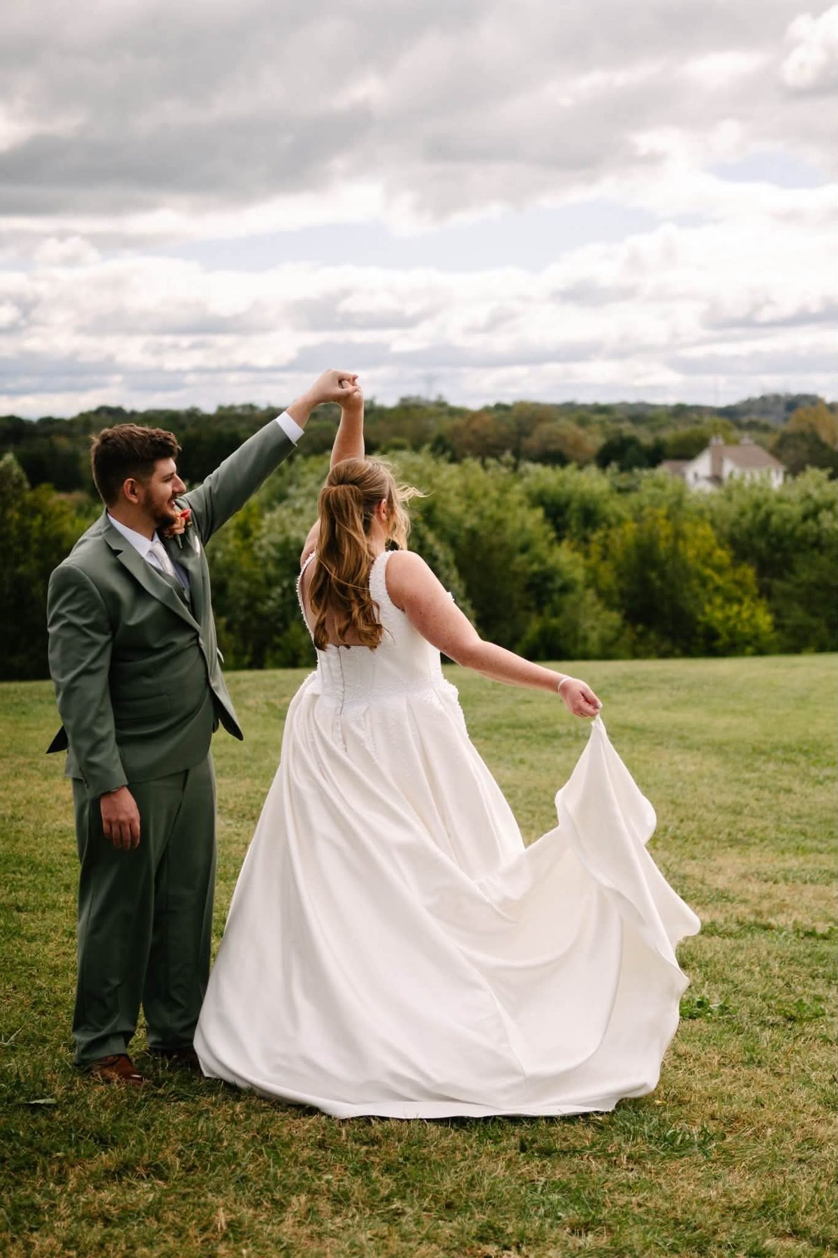 Christine and Graham twirling at golden hour